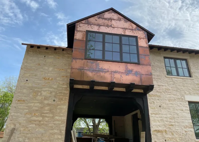 Copper metal panel facade on a stone building for Skylight Installation in Nutley